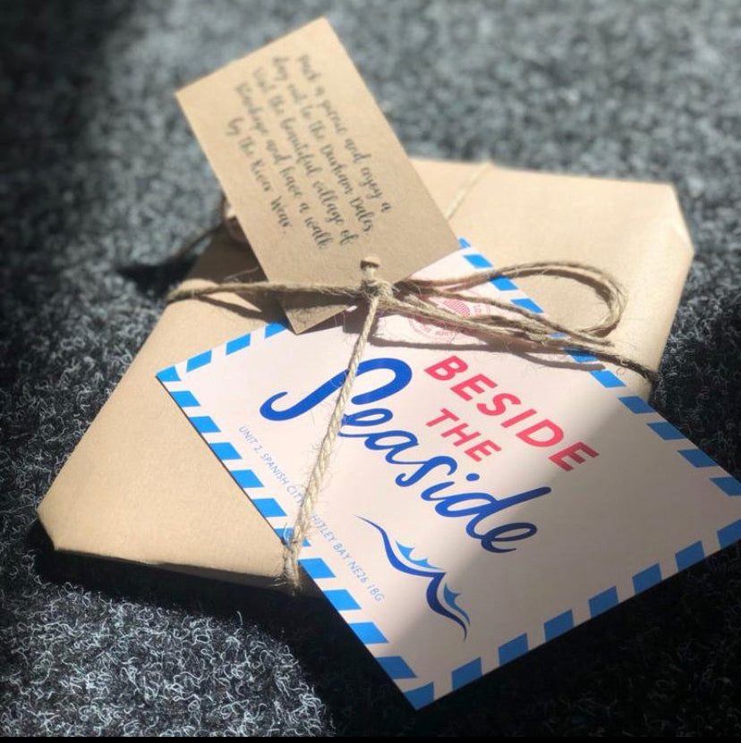 Brown paper packaging tied up with string - For The Love Of The North