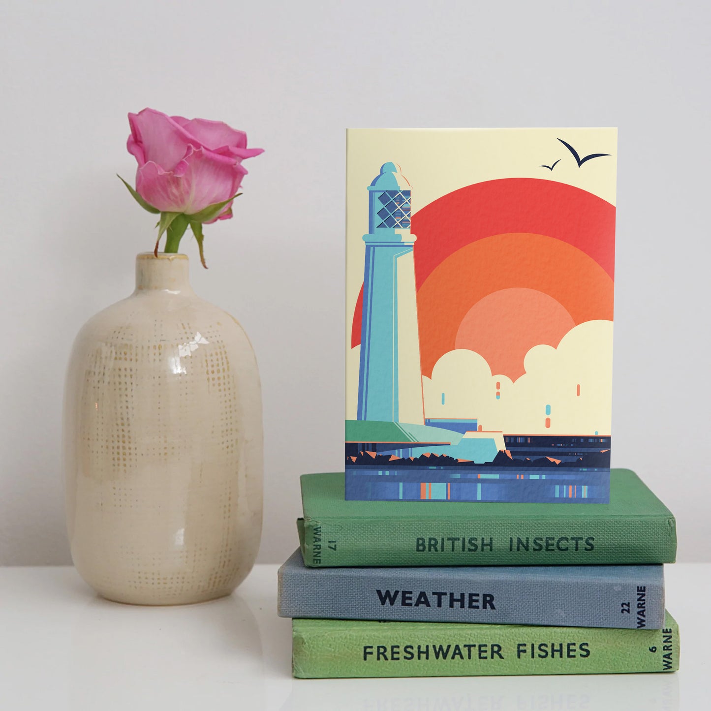 Card showing sunrise behind St Mary’s Lighthouse, Whitley Bay