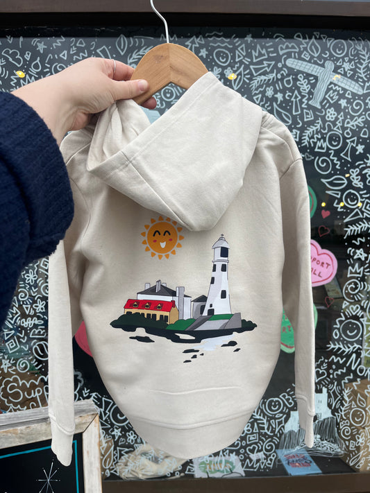Light stone hoodie with a lighthouse design on a hanger against a chalkboard background