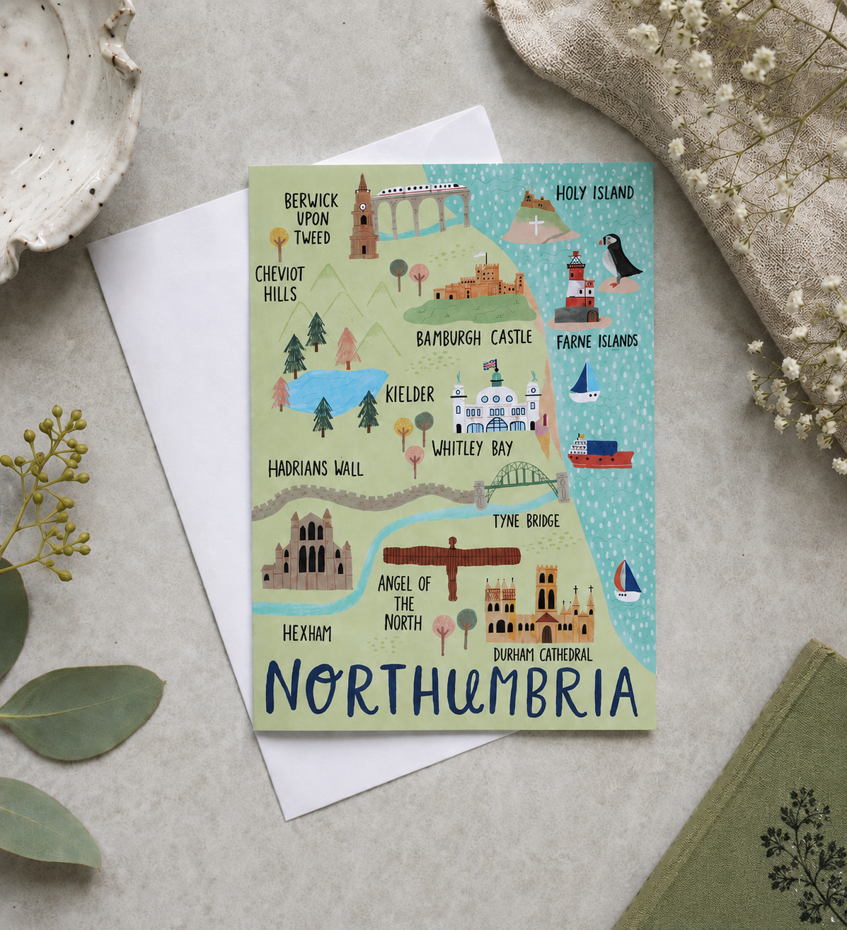 Map of Northumbria on a card with decorative elements on a light surface